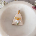 Triangular pet id tag with floral design 